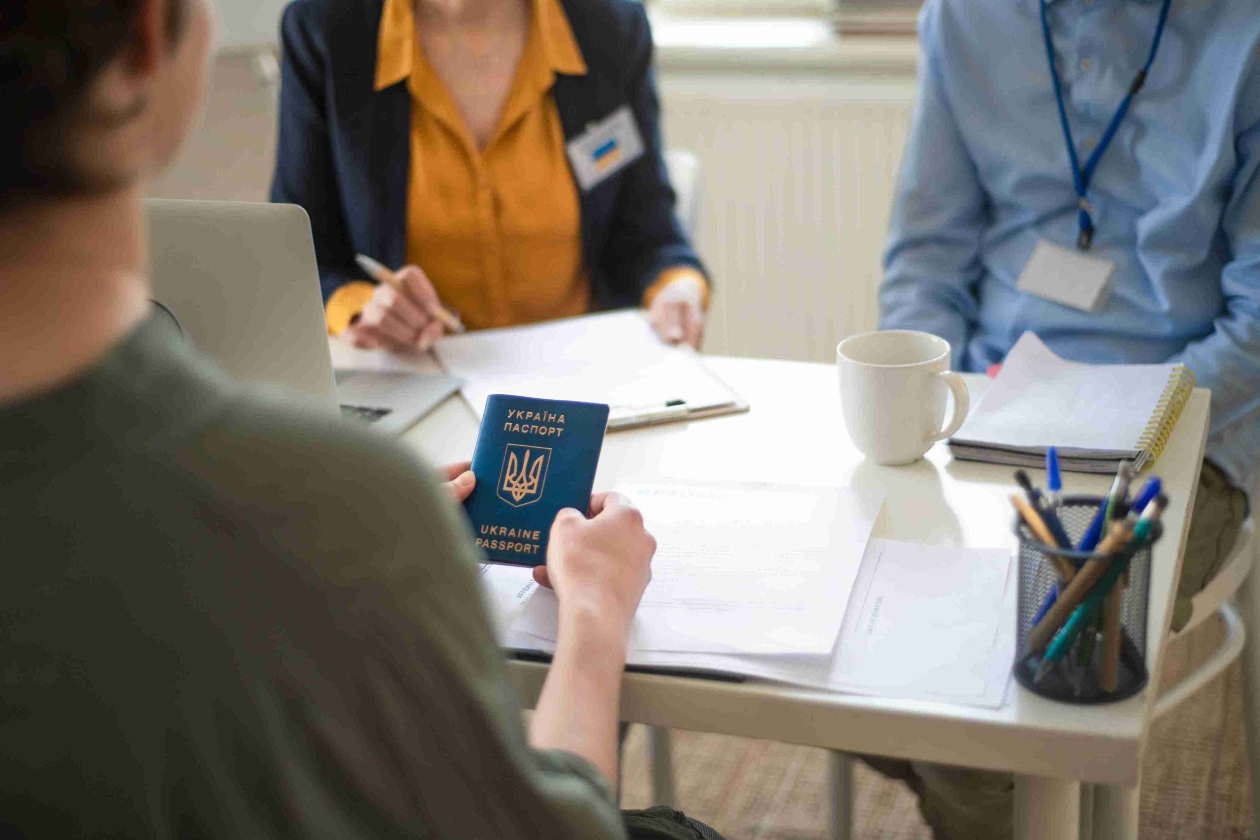 Women holding passport illustrating the concept of personl immigration.