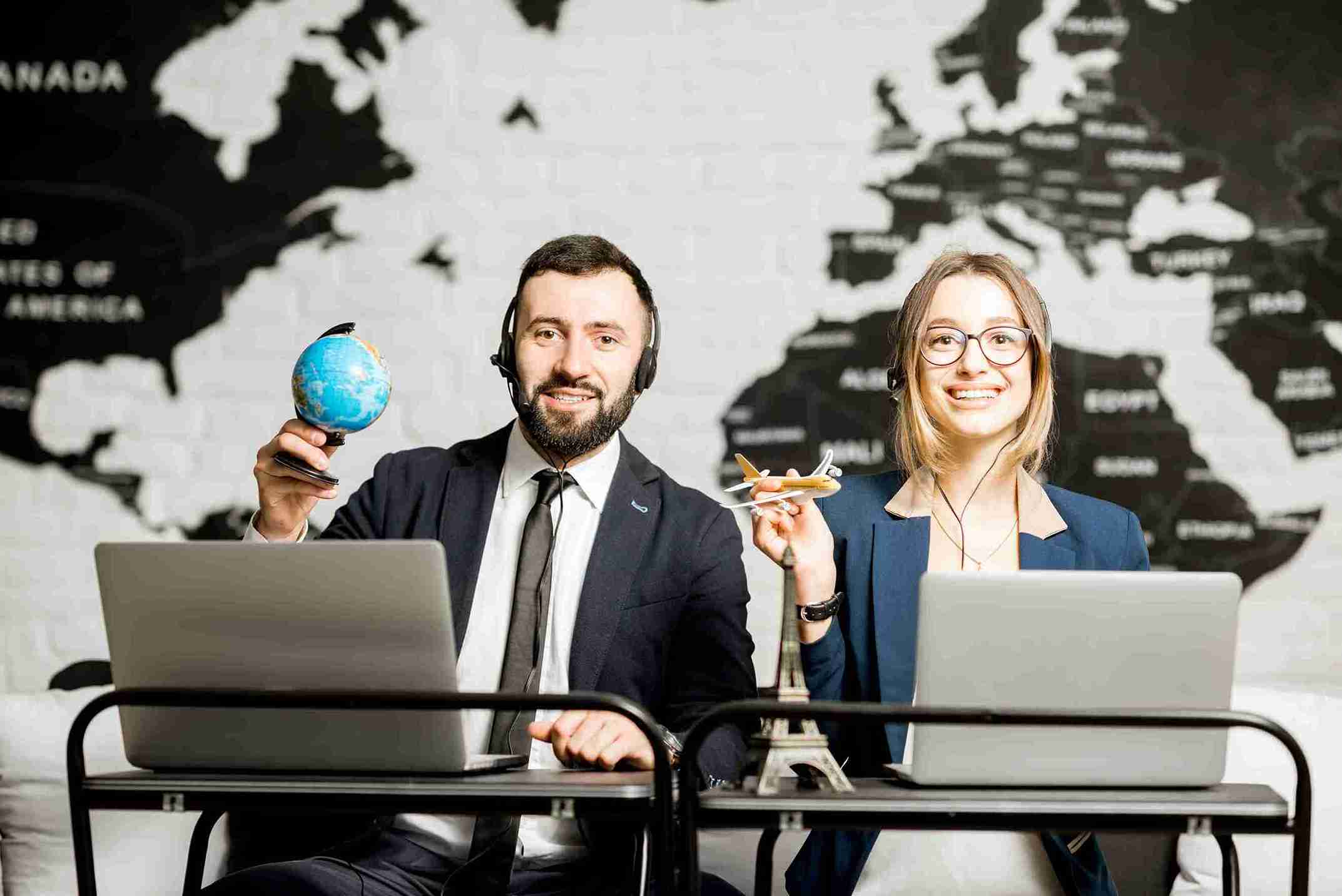 Visa consultants holding globe and plane illustrating Global Mobility Visa.