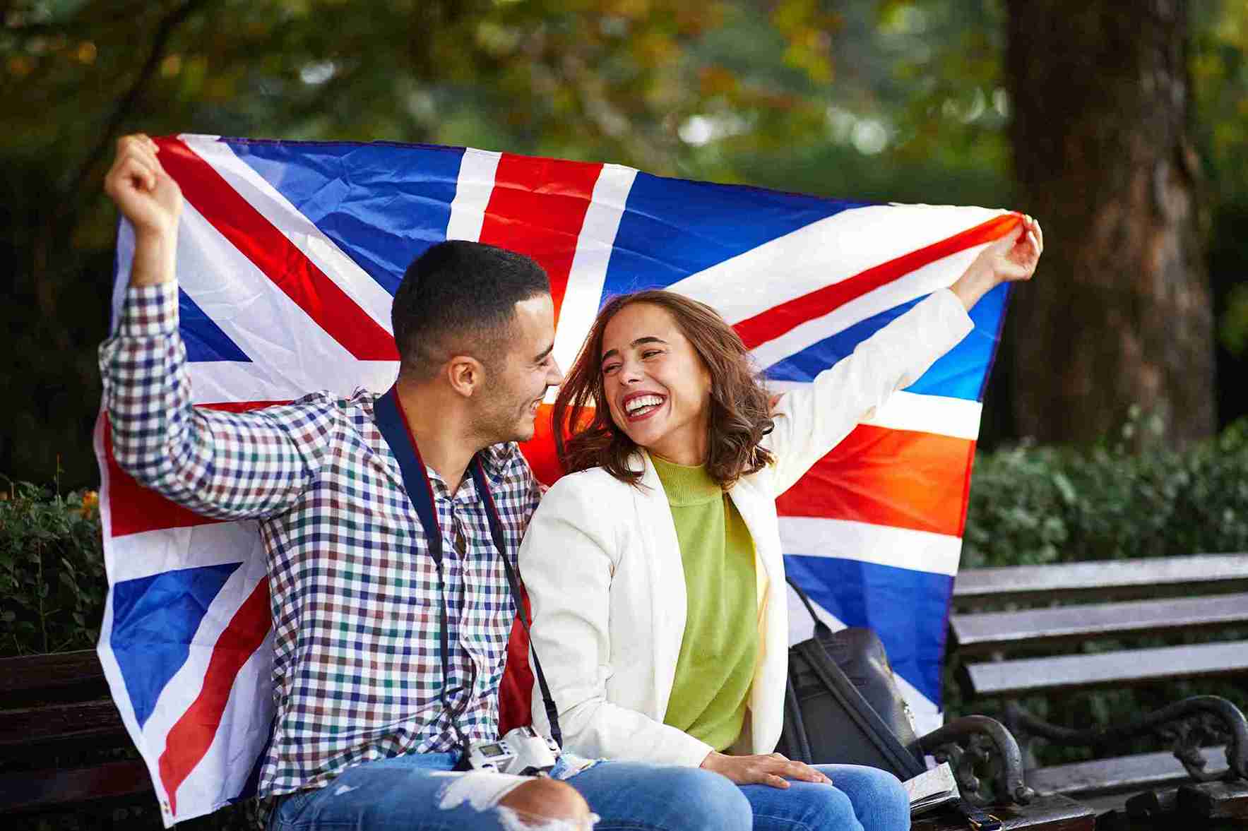 Happy couple celebrate with a UK flag.