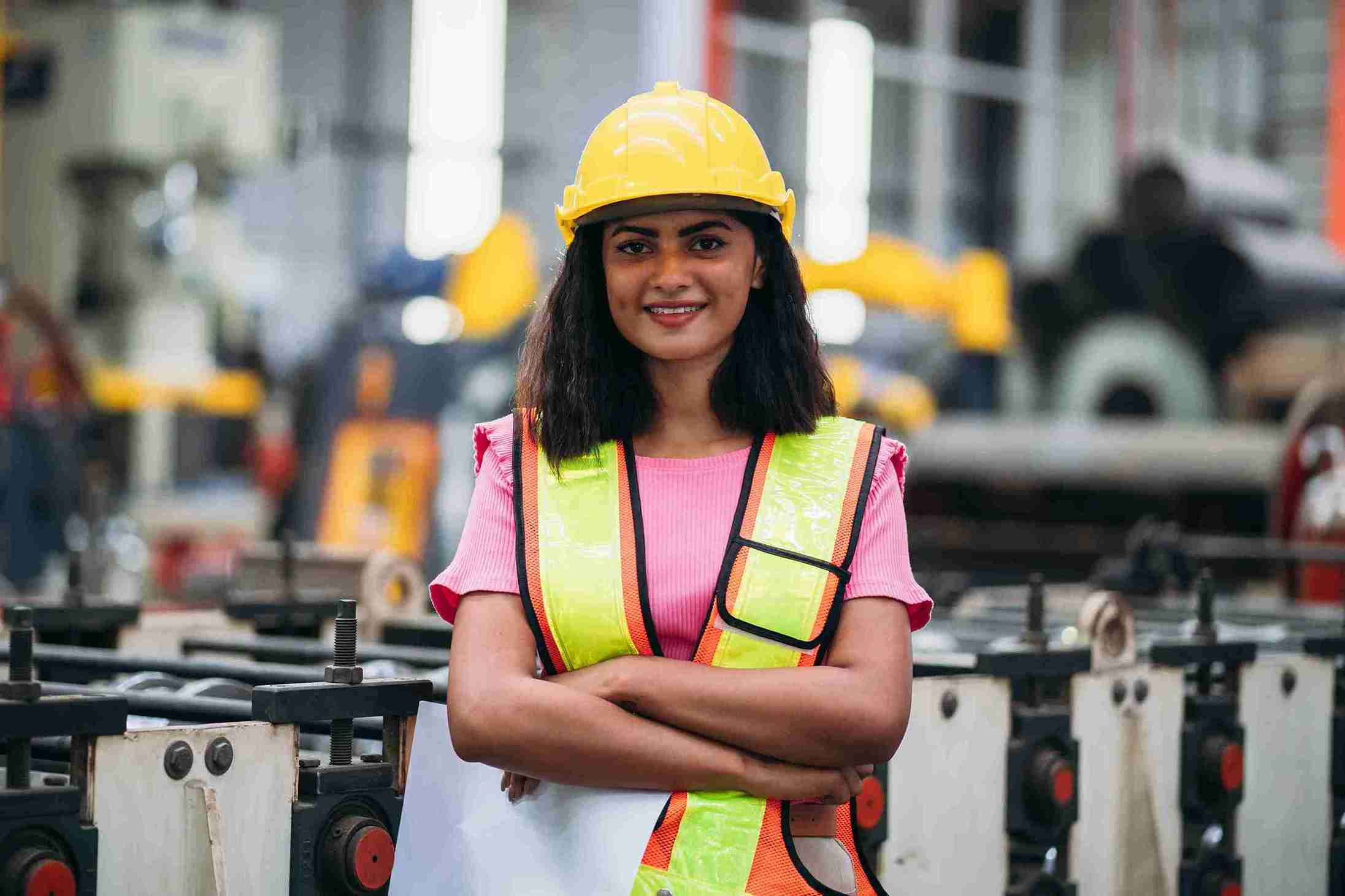 A young women industrial worker inspecting and checking.
