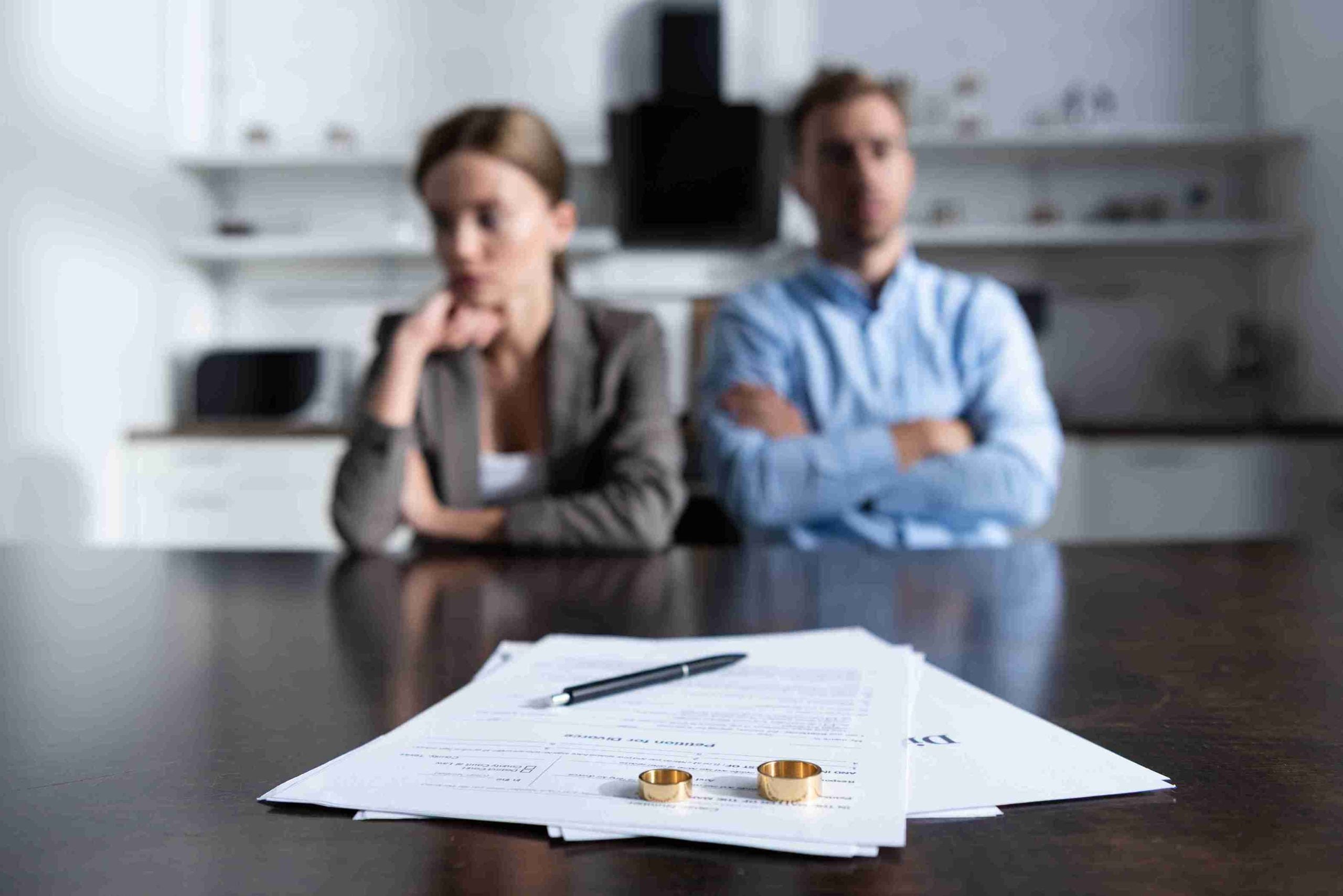 Couple in a lawyer office making decision about divorce.